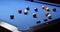 Player shots colourful balls in triangle rack on billiard