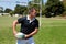 Player throwing rugby ball by goal post