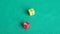 Player throws red and yellow dices four times on green board