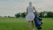 Player in White Sportswear Gets Ready for Golf Game.