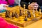 Players play chess on a chessboard with chess pieces in a tournament