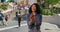 Playful black woman juggling apples in front of Spanish Steps in Rome