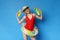 Playful blonde in swimsuit ready for fun with water guns