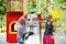 Playful child with parents at the playground outdoor