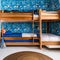 A playful, children\\\'s bedroom with bunk beds, vibrant wallpaper, and plenty of storage space1, Generative AI