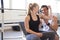 Playful Couple Checking Bicep Muscle Size in Gym