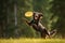 Playful dog catching a frisbee mid-air, bringing laughter and fun to an outdoor adventure. Generative AI