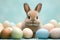 Playful easter bunny rabbit with egg on pastel spring background, copy space for text