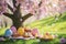 A playful Easter card concept with a group of colorful, cartoon-style Easter eggs having a picnic under a cherry blossom tree,