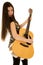 Playful expression on female models face playing her guitar