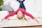 Playful Girl Lying Upside Down On Sofa