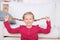 Playful Girl Pulling Her Pigtails At Home