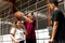 Playful group of teenager friends on a basketball court