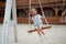 Playful kid swinging swing. Joyful little girl play having fun playground summertime