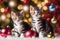 Playful kittens engage with tinsel and festive balls