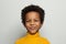 Playful  mischievous black child boy on white background