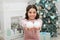 Playful mood. New year eve. Dreams come true. Christmas decorating ideas. Adorable cheerful girl making wish near