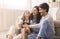 Playful Parents Tickling Their Little Daughter, Having Fun Together At Home