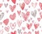 A playful pattern of sketched red and pink hearts of various styles and sizes on a white background