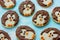 Playful polar penguin cookies on blue background, festive baking