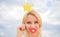 Playful princess. Woman blonde hair hold cardboard tiara or crown and red lips symbol of love sky background. Dream of