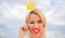 Playful princess. Woman blonde hair hold cardboard tiara or crown and red lips symbol of love sky background. Lady