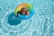 Playful summer kid at beach with rubber circle. Summertime activities or adventure at aquapark. Child weekend or