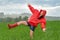 Playful teenage girl dancing in the rain