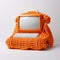 Playful Vintage Aesthetics: Knitted Orange Cable Net Computer