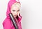 Playful young blonde in a tracksuit holding baseball bat