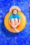 Playful young boy in a summer swimming pool