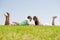 Playful young couple laying on a grass lawn