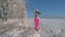 Playful Young Woman On Sunny Day In Winter, Pulls Tree Branch And Falling Snow.