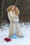 Playful young woman in a winter forest