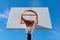 Playground basketball hoop with torn net