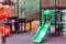 Playground in the courtyard of a residential building, children`s attractions, leisure, child development and health.