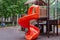 Playground in the courtyard of a residential building, children`s attractions, leisure, child development and health.