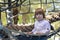 Playground. Grid for games. Rope park. A little boy sits in a hammock