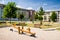 Playground in nature in front of row of newly built block of flats