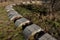 Playground obstacle course. jump over snake-shaped concrete arches. with shape in concrete gutters laid upside down in a row in a