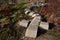 Playground obstacle course. jump over snake-shaped concrete arches. with shape in concrete gutters laid upside down in a row in a