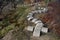 Playground obstacle course. jump over snake-shaped concrete arches. with shape in concrete gutters laid upside down in a row in a