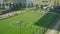 Playground with running track, football pitch and basketball court inside.