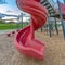 Playground with spiral slide and climbing frames