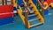 Playground staircase wrapped in barrier tape closeup. Prohibition of outdoor walks with children, prevention of infection with the