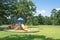 Playground under lush of Oak tree