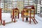 Playground wooden red houses swing rope winter