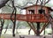 Playhouse for children on the tree among trees in the forest