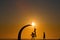 Playing basketball at sunset with natural sky background