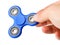 Playing with a blue Fidget Spinner